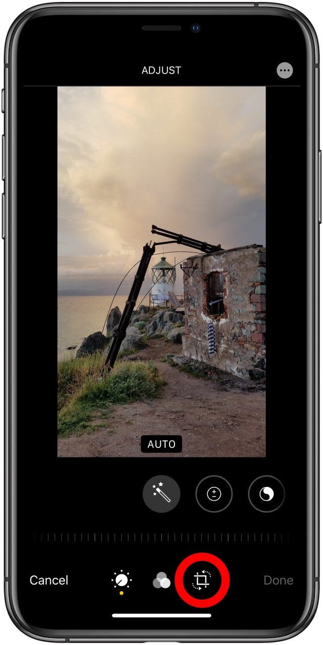 The edit photo screen in the Photos app with the crop-rotate icon highlighted